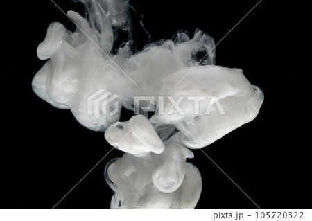 Abstract paint splash isolated on black background. Acrylic ink in water. selective focus. 105720322