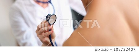 Female cardiologist examining problems with heart of male patient in clinic. Female cardiologist examining problems with heart of male patient in clinic. 105722407
