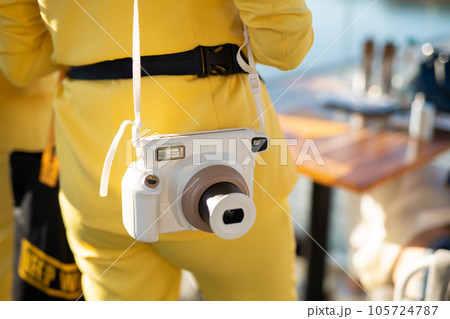 a modern fashionable film camera that takes instant photos 105724787