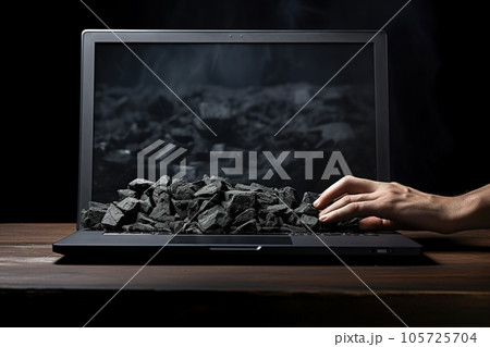 Portable laptop computer with a black coal on the screen 105725704
