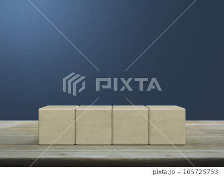 Four block cubes on wooden table Four block cubes on wooden table 105725753