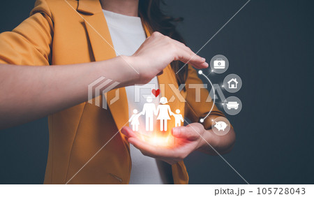 Hands with protective gesture around cutout paper of family. protecting family, insurance, domestic violence, world mental health day, international day of families, family day, family care concept. 105728043