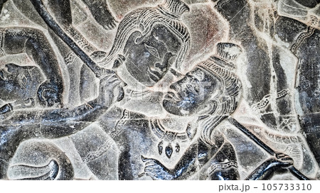 Wall carving of Khmer Culture in Ancient ruins Angkor Wat temple - famous Cambodian landmark. Siem Reap, Cambodia. Wall carving of Khmer Culture in Ancient ruins Angkor Wat temple - famous Cambodian landmark. Siem Reap, Cambodia. 105733310