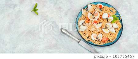 Spaghetti pasta with clams, space for text. Spaghetti pasta with clams, space for text. 105735457