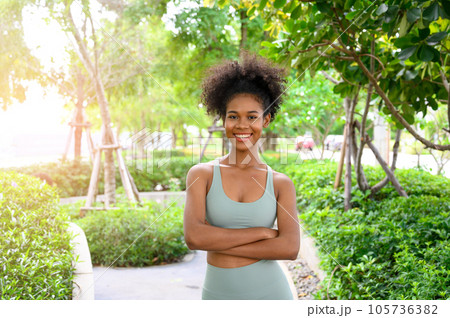 Portrait of black woman, afro hairstyle in outdoor park. Beautiful African woman preparing, practicing, training, sport, lifestyle, summer mood concept. 105736382