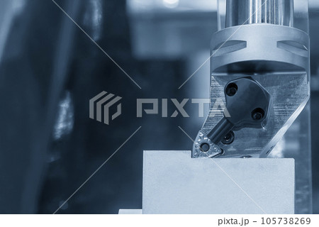 Close up  the metal shaft part and the lathe tool in the light blue scene. 105738269
