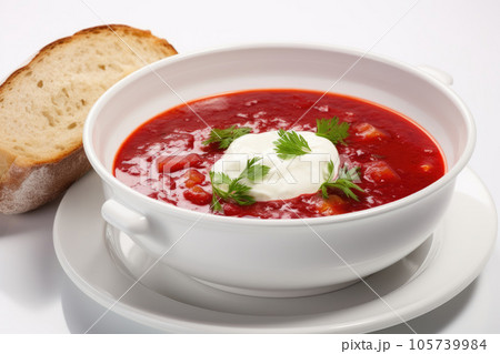Cold soup with sour cream in a plate with bread 105739984