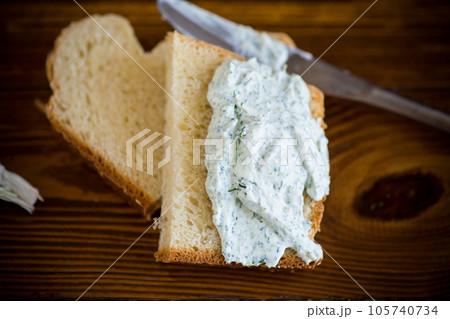 homemade salted curd spread with herbs and garlic homemade salted curd spread with herbs and garlic 105740734