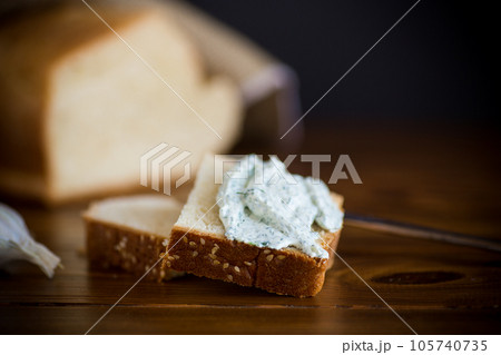 homemade salted curd spread with herbs and garlic homemade salted curd spread with herbs and garlic 105740735