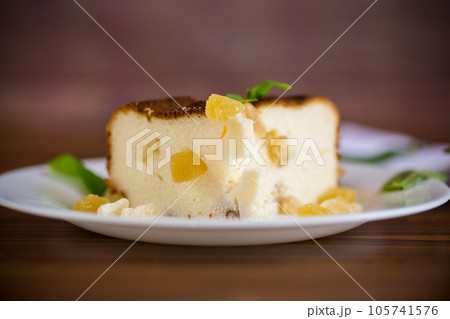 sweet baked cottage cheese casserole with nuts and candied fruits 105741576