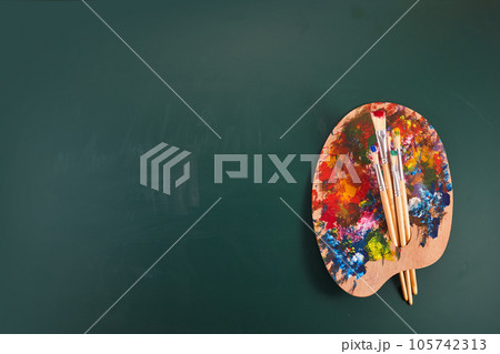 Back to art school. Painting courses. Art palette on chalkboard. Back to art school. Painting courses. Art palette on chalkboard. 105742313