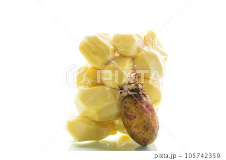 peeled potatoes closed in a vacuum bag and old sprouted potatoes peeled potatoes closed in a vacuum bag and old sprouted potatoes 105742359