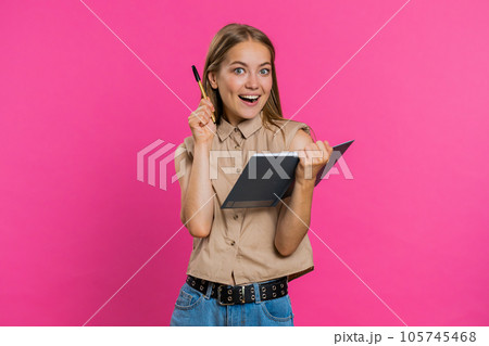 Woman making notes writing down thoughts with pen into notepad notebook diary, to do list, good idea Woman making notes writing down thoughts with pen into notepad notebook diary, to do list, good idea 105745468