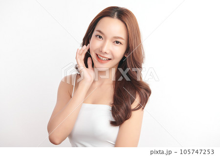 Beautiful young asian woman with clean fresh skin on white background, Face care, Facial treatment, Cosmetology, beauty and spa, Asian women portrait. Beautiful young asian woman with clean fresh skin on white background, Face care, Facial treatment, Cosmetology, beauty and spa, Asian women portrait. 105747253