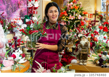 Asian woman in showroom of christmas goods store 105748460
