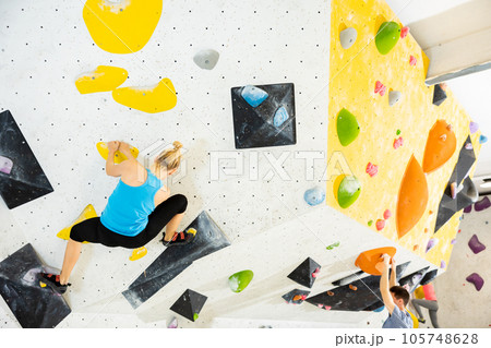 Woman exercising in climbing gym 105748628