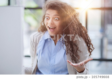 Emotional girl surprised with getting victory in online contest reading news from laptop computer Emotional girl surprised with getting victory in online contest reading news from laptop computer 105749608