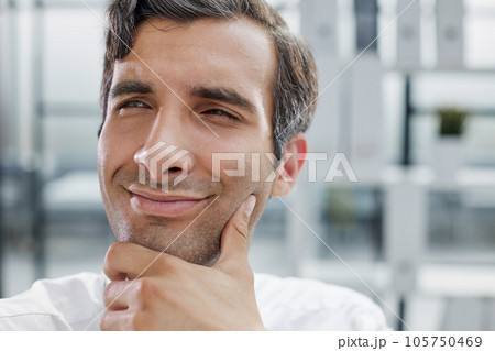 close-up, portrait of a serious businessman on the background of the office close-up, portrait of a serious businessman on the background of the office 105750469
