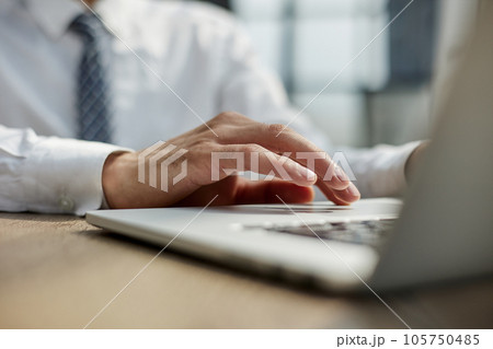 close-up. business man works on a laptop. 105750485