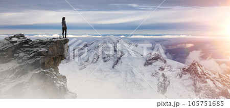Epic Adventure Composite of woman Hiker on top of a rocky mountain. Epic Adventure Composite of woman Hiker on top of a rocky mountain. 105751685