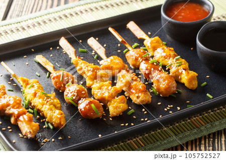 Yakitori grilled chicken japanese style closeup on the plate. Horizontal Yakitori grilled chicken japanese style closeup on the plate. Horizontal 105752527