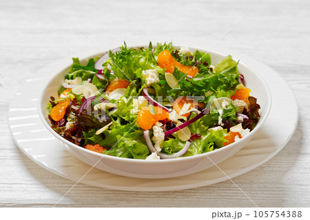Mandarin Orange Salad in white bowl, top view Mandarin Orange Salad in white bowl, top view 105754388