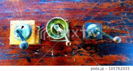 Antique coffee grinders on the table in the garden. Antique coffee grinders on the table in the garden. 105762035