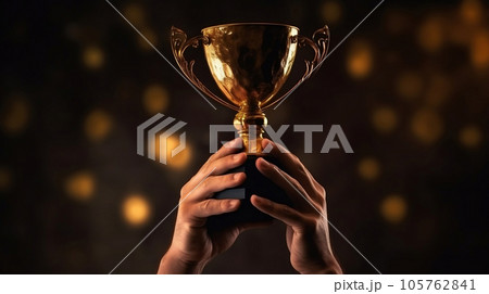 Hands of a man raising golden trophy after winning competition with glowing bokeh on black background, succees concept. Generative AI 105762841