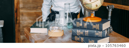 Schoolgirl perform chemical experiments. School and preschool education. Schoolgirl perform chemical experiments. School and preschool education. 105763460