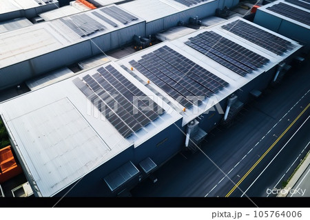 Solar panels installed on a roof of a large industrial building or a warehouse. Solar panels installed on a roof of a large industrial building or a warehouse. 105764006