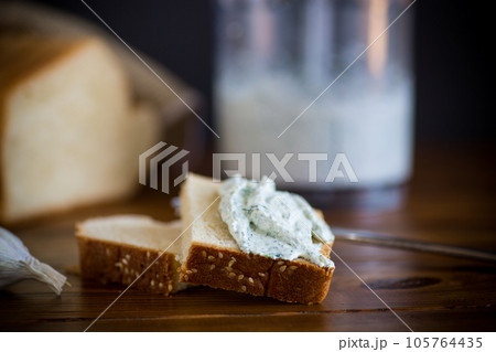 homemade salted curd spread with herbs and garlic homemade salted curd spread with herbs and garlic 105764435