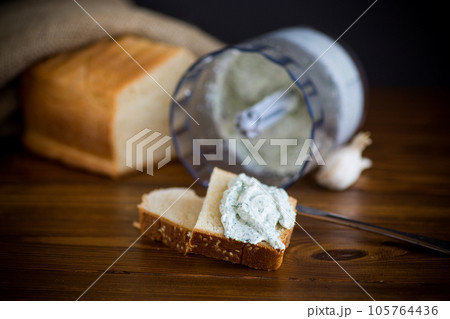 homemade salted curd spread with herbs and garlic 105764436