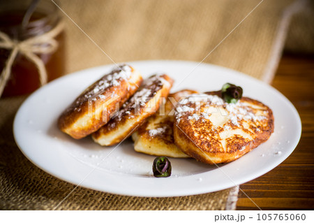 sweet fried cottage cheese pancakes in a plate sweet fried cottage cheese pancakes in a plate 105765060