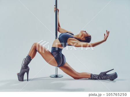 Woman pole dancing 105765250