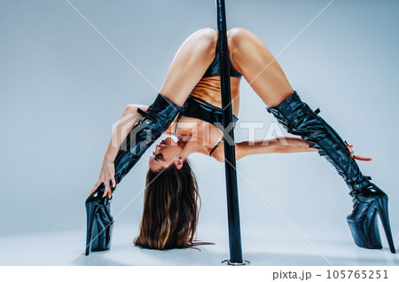 Woman pole dancing 105765251
