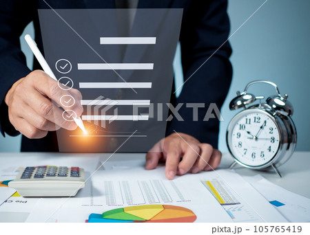 Businessman use electronic pen sign signature on electronic E-signing, data sheet document management, Electronic signature and paperless office concept. Businessman use electronic pen sign signature on electronic E-signing, data sheet document management, Electronic signature and paperless office concept. 105765419