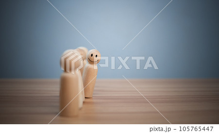 concept Business and HR for leadership and team leader, one wooden dolls stand out in front  Different and stand out from the group 105765447