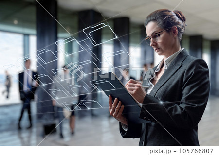 Businesswoman working with data archive in the business center. Businesswoman working with data archive in the business center. 105766807