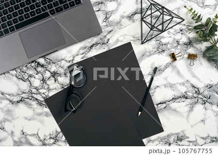 Top view in focus with different office equipment, supplies, stationery. Marble table with copy space. Education, workplace background. Close-up. Top view in focus with different office equipment, supplies, stationery. Marble table with copy space. Education, workplace background. Close-up. 105767755