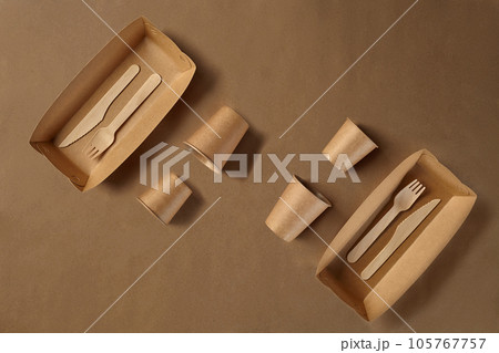 Eco friendly disposable tableware. Biodegradable craft dishes. Recycling concept. Also used in fast food, restaurants, takeaways, picnics. Close-up. 105767757