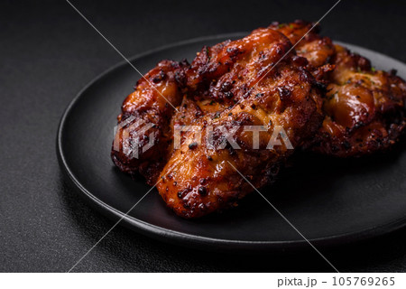 Delicious baked chicken meat with salt, spices and herbs Delicious baked chicken meat with salt, spices and herbs 105769265