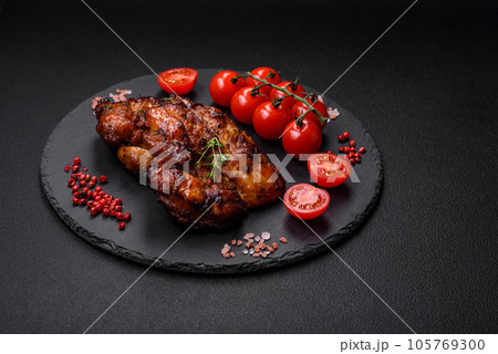 Delicious baked chicken meat with salt, spices and herbs Delicious baked chicken meat with salt, spices and herbs 105769300