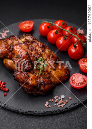 Delicious baked chicken meat with salt, spices and herbs Delicious baked chicken meat with salt, spices and herbs 105769304