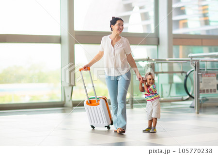 Family in airport. Kids fly. Travel with child. 105770238