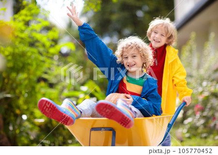 Kids on pumpkin patch. Child autumn outdoor fun. 105770452