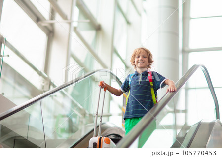 Family in airport. Kids fly. Travel with child. 105770453