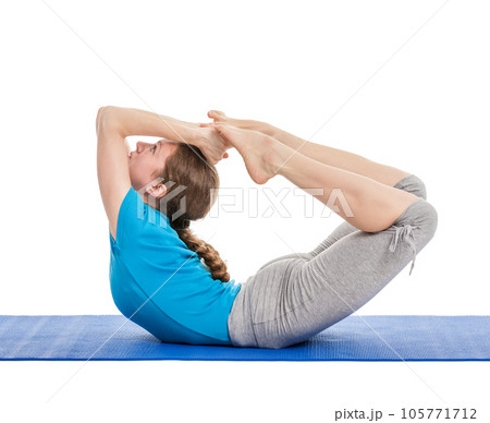 Yoga - young woman yoga instructor doing Bow pose (Balancing on abdomen in the shape of a bow) rocking dhanurasana asana exercise isolated on white Yoga - young woman yoga instructor doing Bow pose (Balancing on abdomen in the shape of a bow) rocking dhanurasana asana exercise isolated on white 105771712