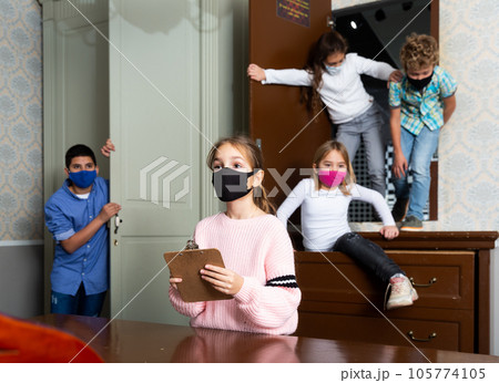 Quest game - team of little friends in protective masks looking for a way out of room 105774105