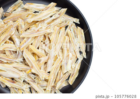 Dried anchovy on white background. Dried anchovy on white background. 105776028