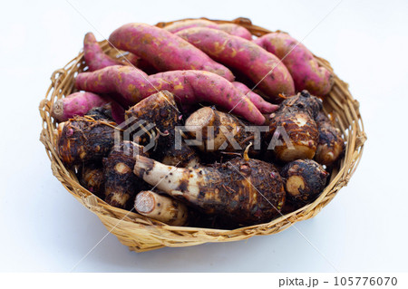 Sweet potato with taro in bamboo basket on white background. 105776070